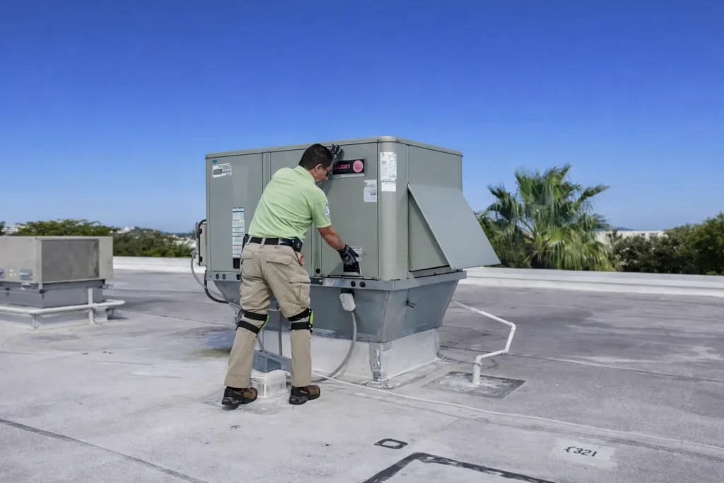 Home inspector assessing a rooftop HVAC system during a commercial property inspection in Miami-Dade.