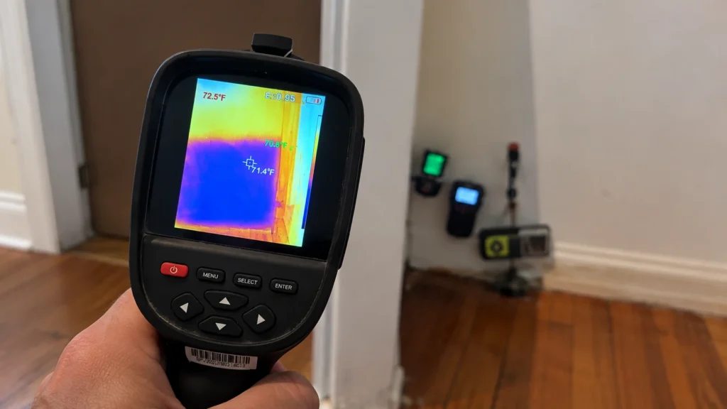 Home inspection using thermal imaging tools inside an apartment in Coral Gables, FL.